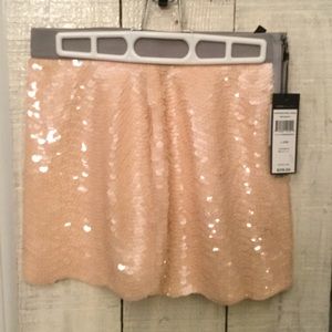 Gorgeous BCBG mini sequin peach in color skirt.